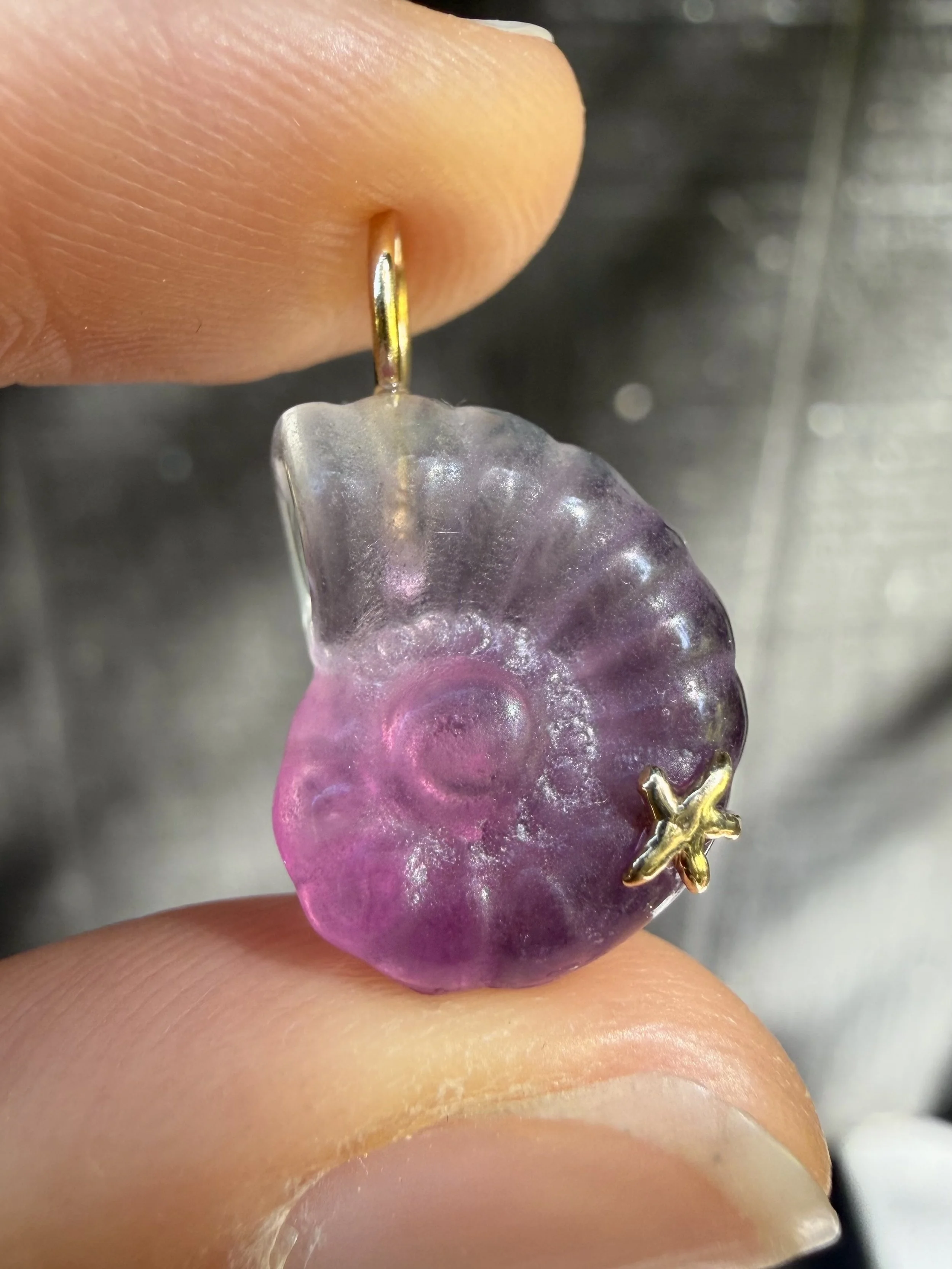 Pink fluorite nautilus charm close up.jpeg