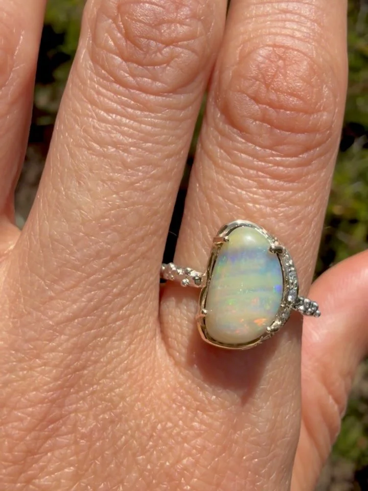 This unique Australian boulder opal feels like early morning walks through coastal marine layer 💛🌈✨ The soft glow of the sun about to peek out, a light fog, and the colors of the coast all mixed into one beautiful opal!

Fun fact, did you know the 