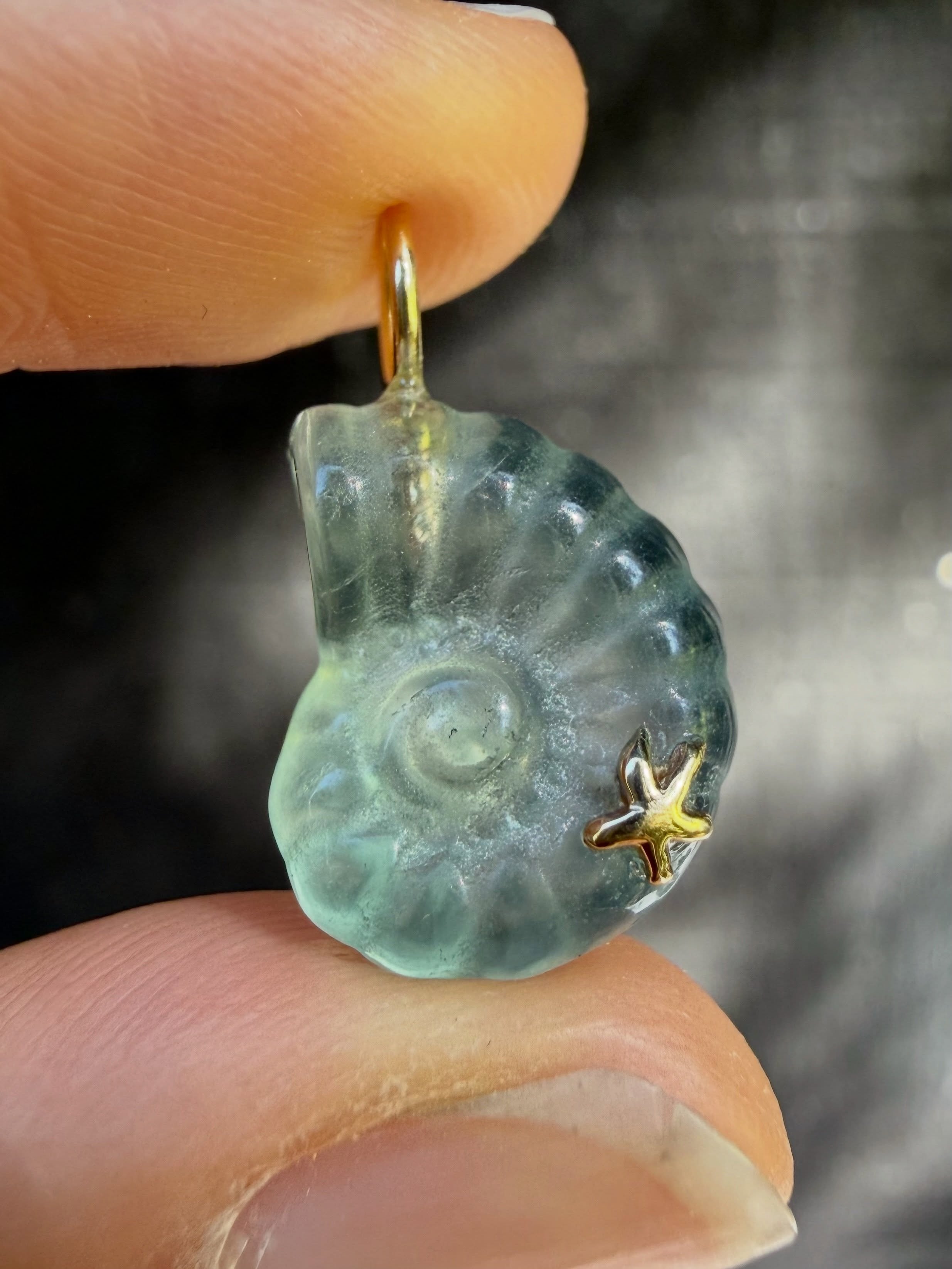*Surprise!* The Latest Drop page on the website has been updated with gorgeous Nautilus charms carved from fluorite, complete with the sweetest starfish detail 🌟 There are 5 currently available! All one of a kind with unique colors, sparkle, and glo