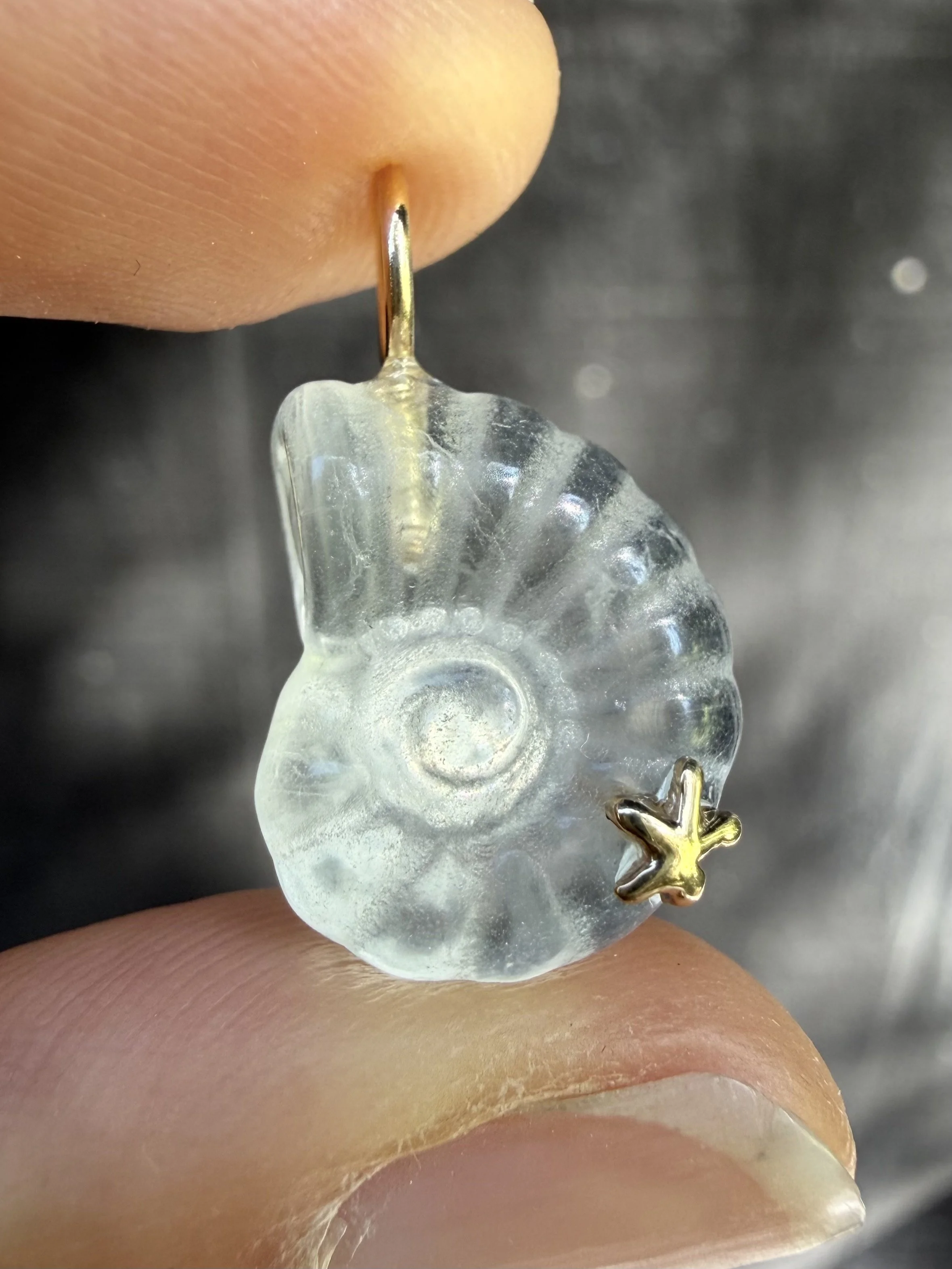 Clear fluorite nautilus charm close up.jpeg