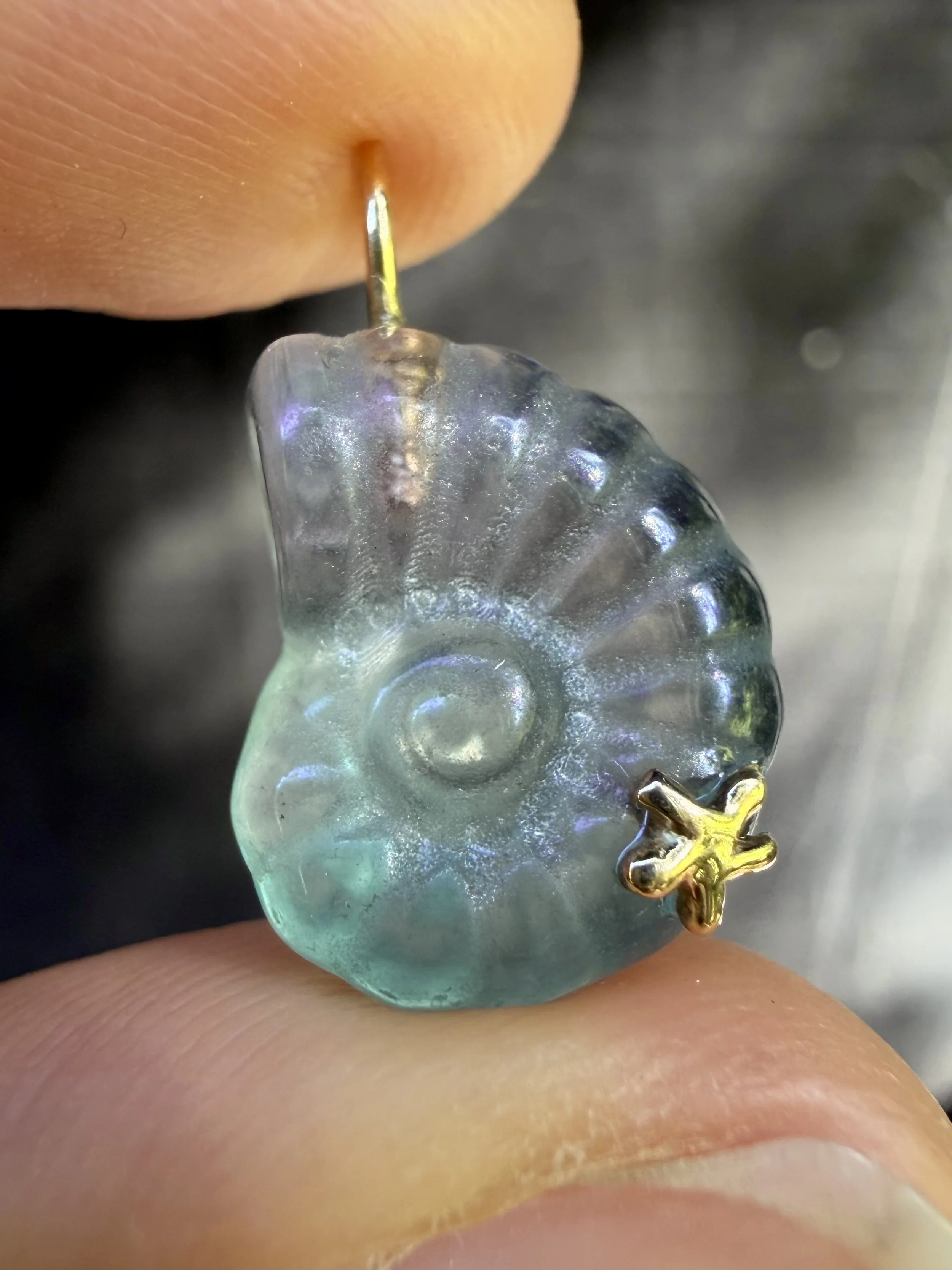 Purple:green fluorite nautilus charm close up.jpeg