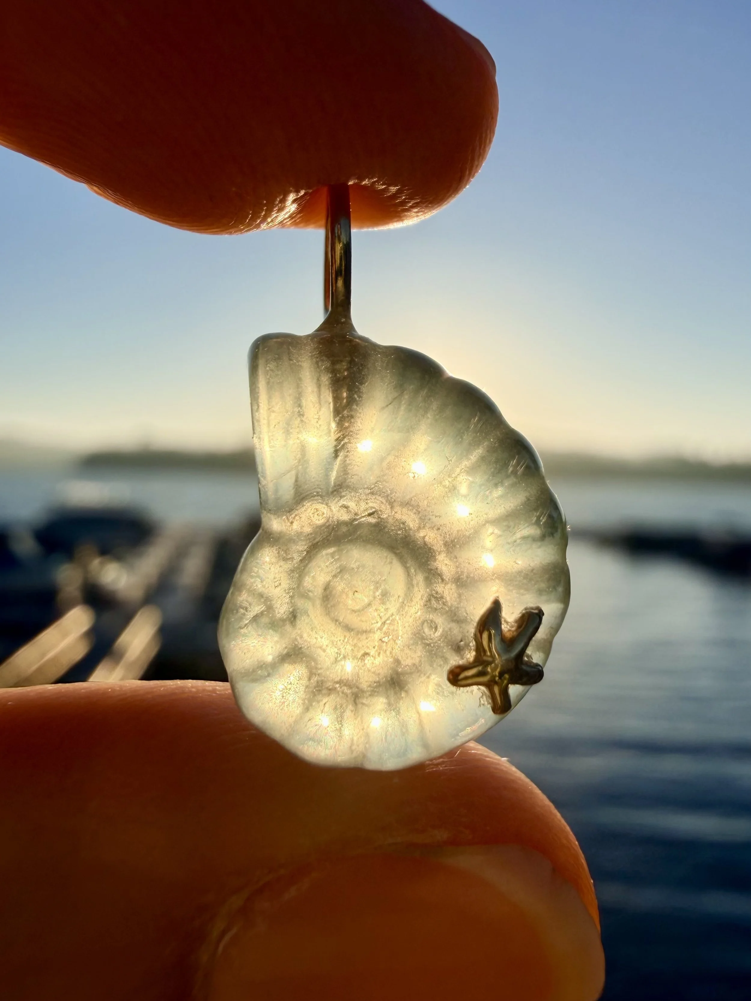 Green fluorite nautilus charm sun.jpeg