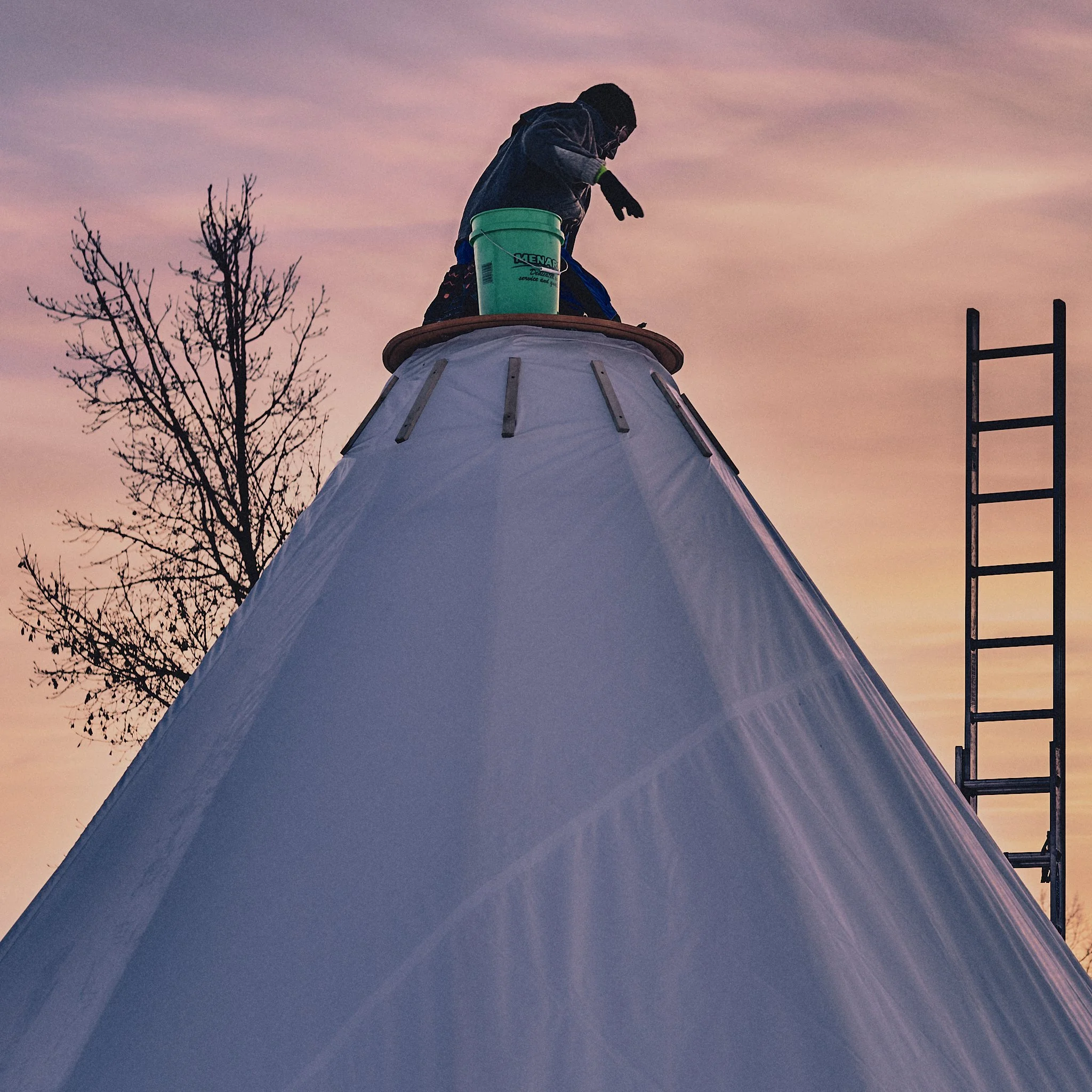 standing-rock-tent-build-ladder-2048px.jpg