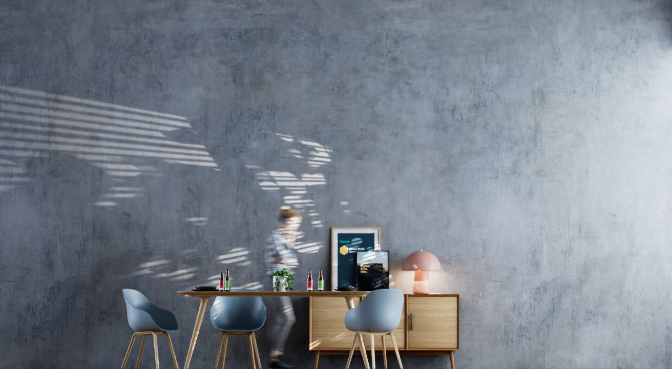 Modern interior dining area with a minimalistic wooden table, four light blue chairs, a sideboard with a pink lamp, framed artwork, and a blurred person walking past.