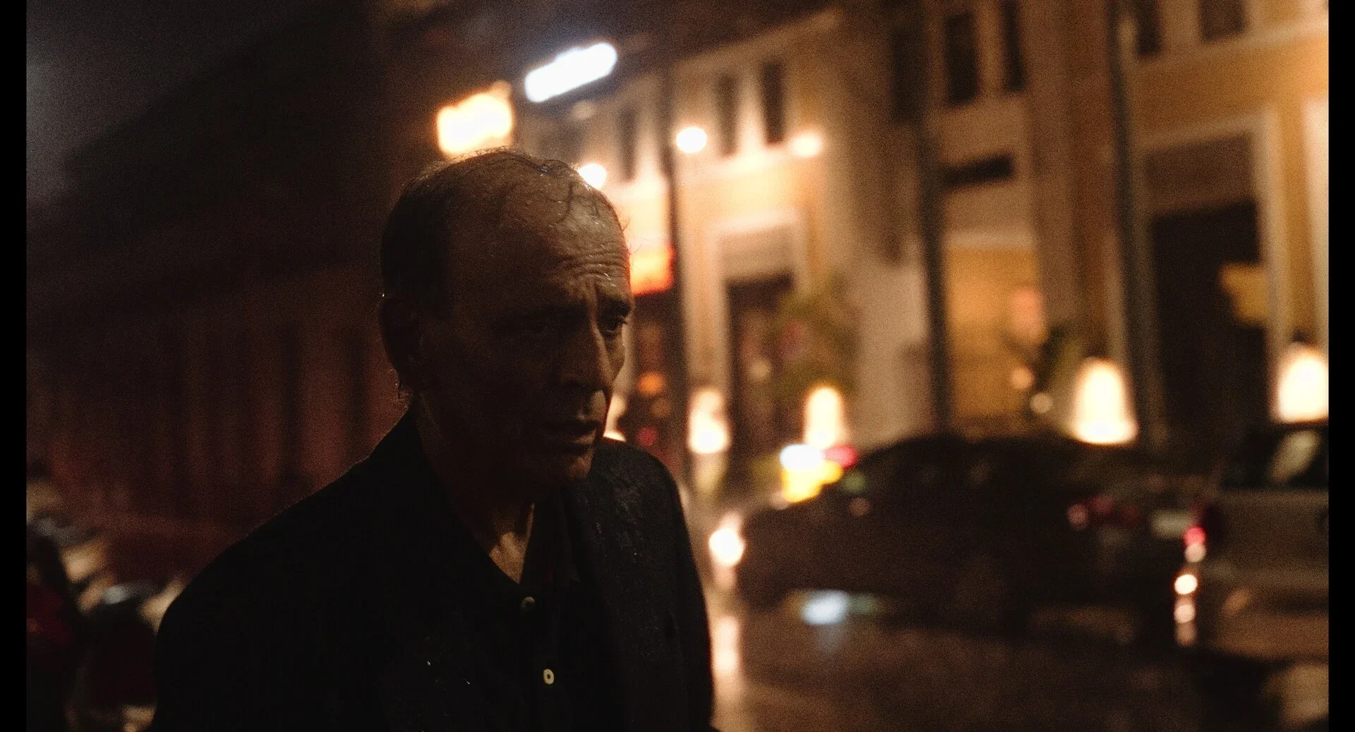 old mn walking on the street