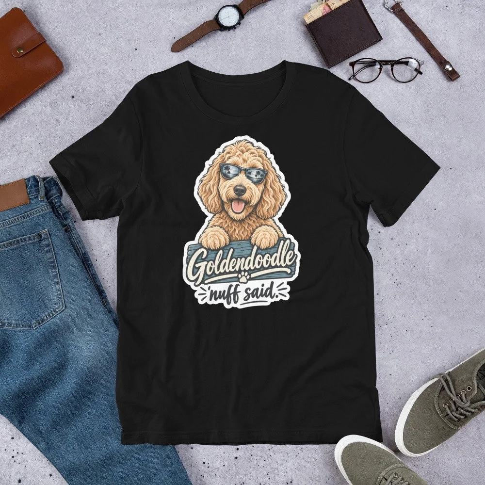Goldendoodle ’Nuff Said T-shirt design featuring a happy curly-haired doodle wearing sunglasses with palm trees reflected in the lenses. unisex-staple-t-shirt-black-front
