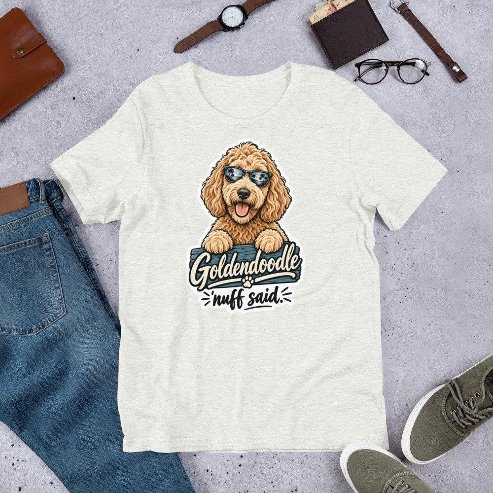 Goldendoodle ’Nuff Said T-shirt design featuring a happy curly-haired doodle wearing sunglasses with palm trees reflected in the lenses. unisex-staple-t-shirt-ash-front