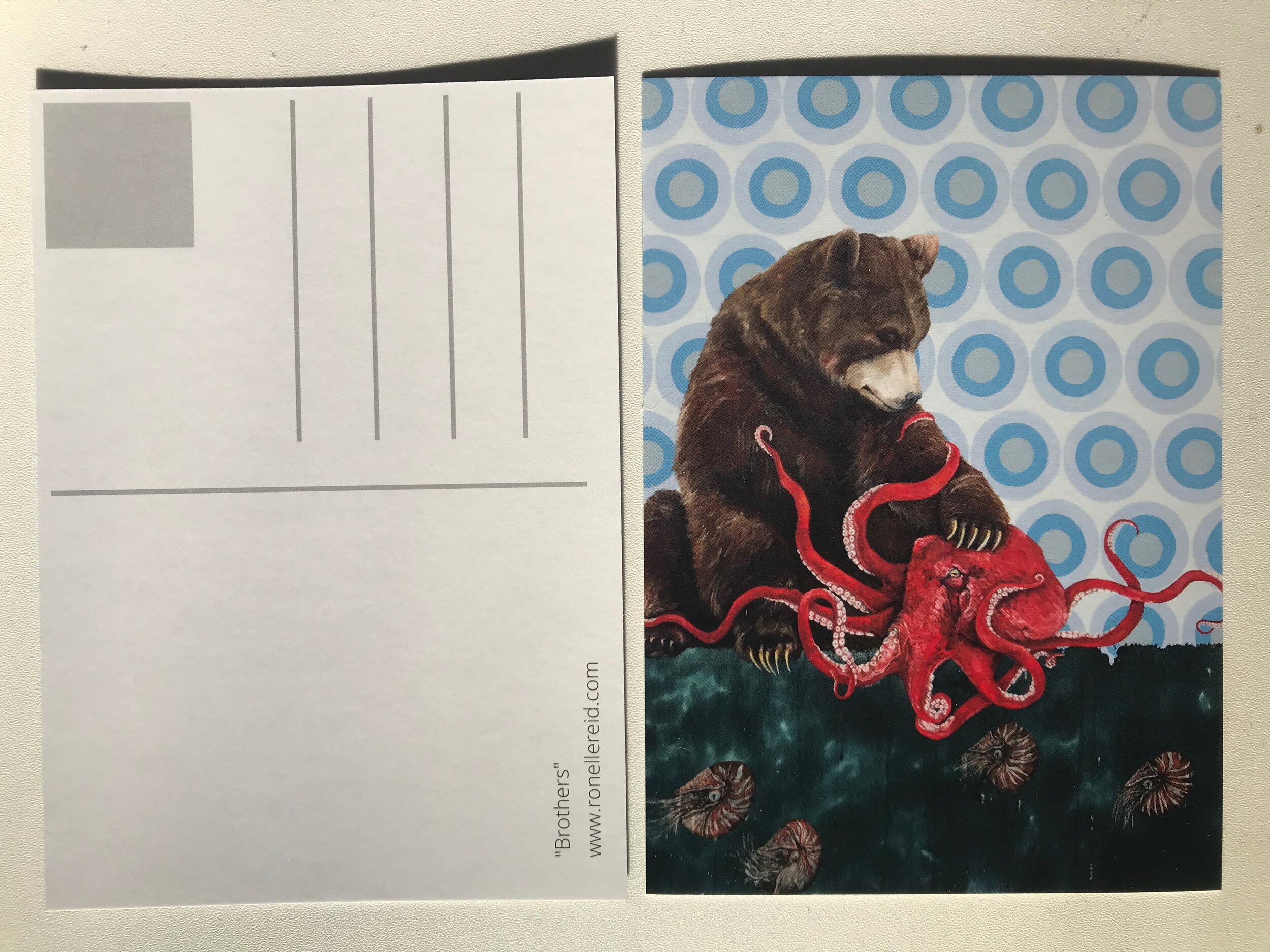 postcard depicting original artwork of a bear hugging an octopus
