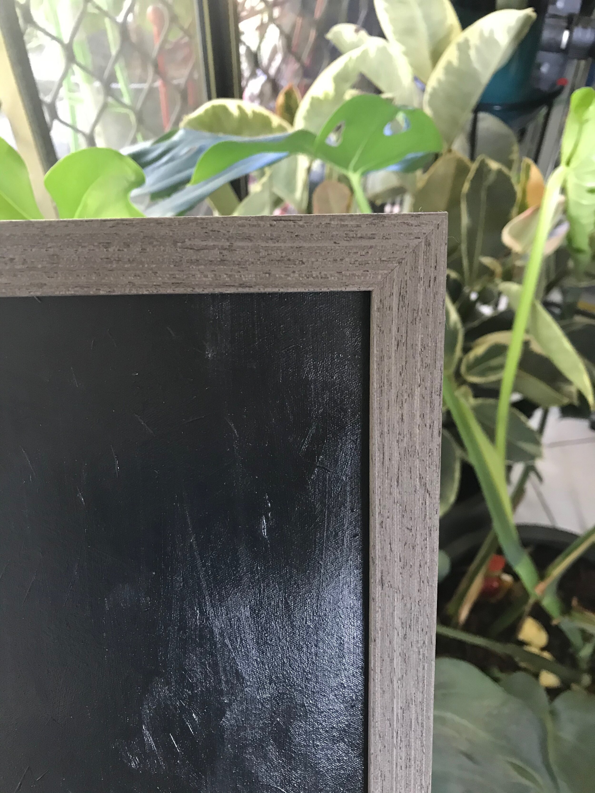 grey wooden frame around original artwork