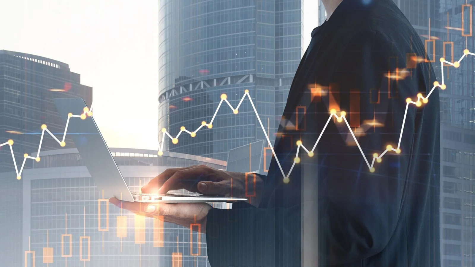 A person in business attire, holding a tablet, with digital stock market graphs and candlestick charts superimposed, set against a backdrop of high-rise office buildings.