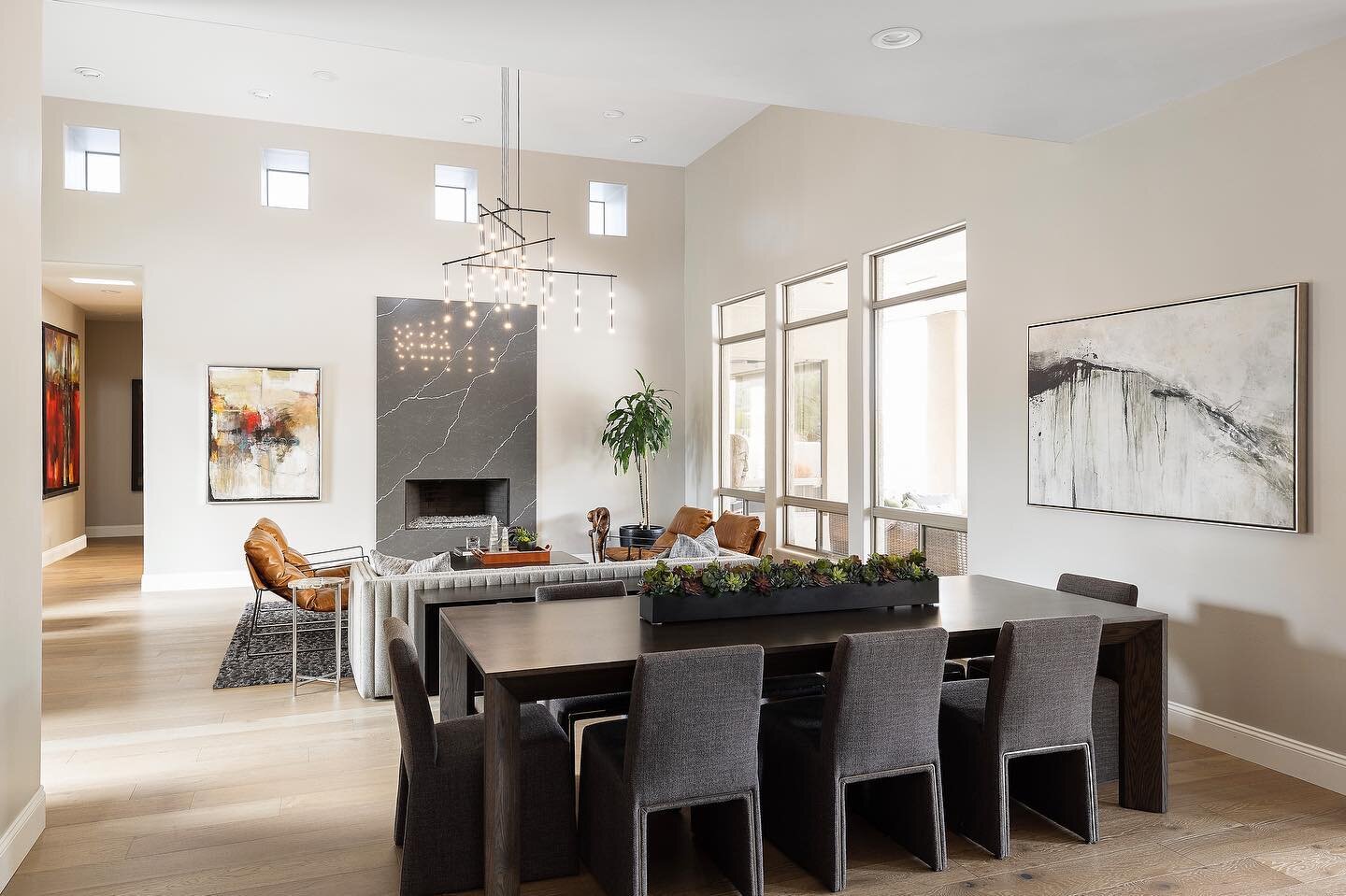 With lofty ceilings, abundant natural light, a tri-bar suspension chandelier, and comfortable yet unique seating details - the great room at our Scottsdale contemporary invites guests to experience Arizona living at its best. 
.
.
.
.
.
.
.
.
.
.
.
.