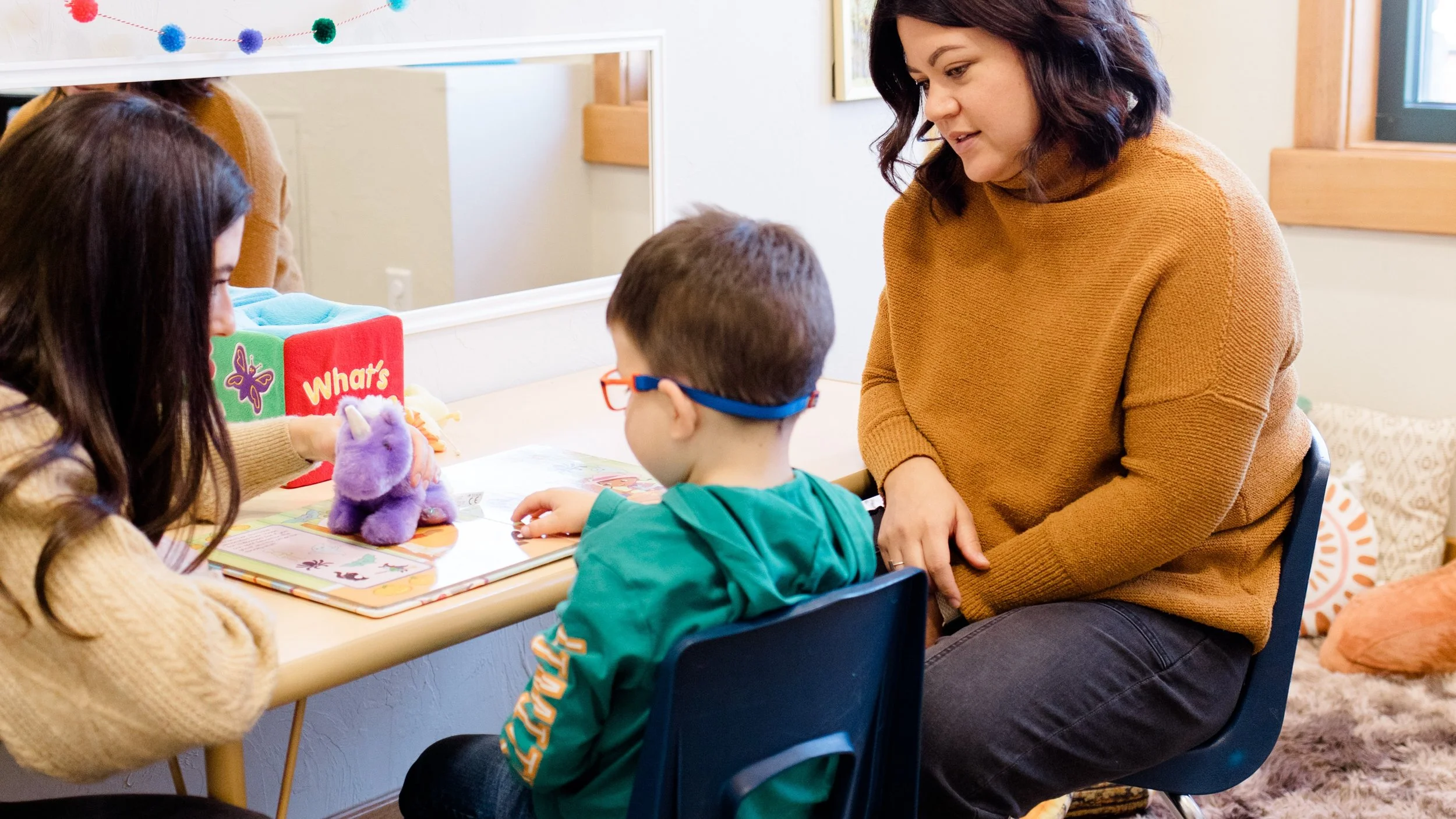 A mom and child at therapy