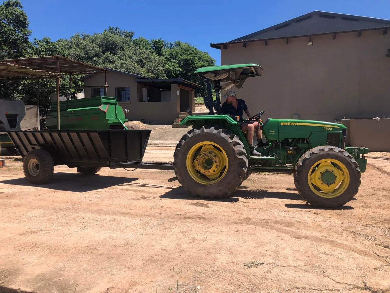 The perfect trailer to harvest Macadamias and dump husks. —