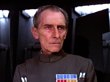  Peter Cushing as Grand Moff Tarkin  dir. George Lucas,  Star Wars Episode IV: A New Hope , 1977  Image here via:  https://en.wikipedia.org/wiki/Grand_Moff_Tarkin#/media/File:Grand_Moff_Tarkin.png  