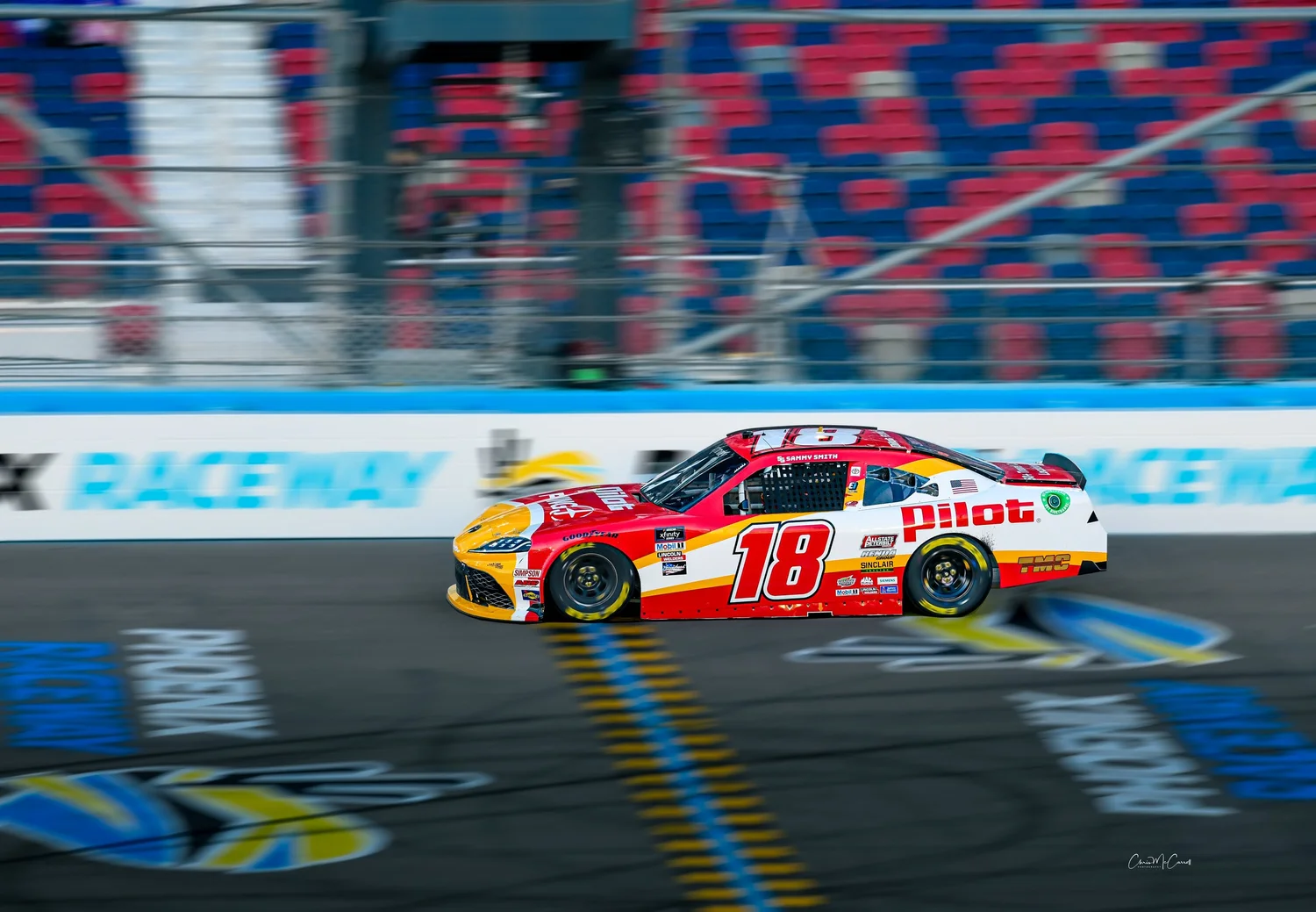 Race car panning photograph: movement and energy; bridge between stills and motion.