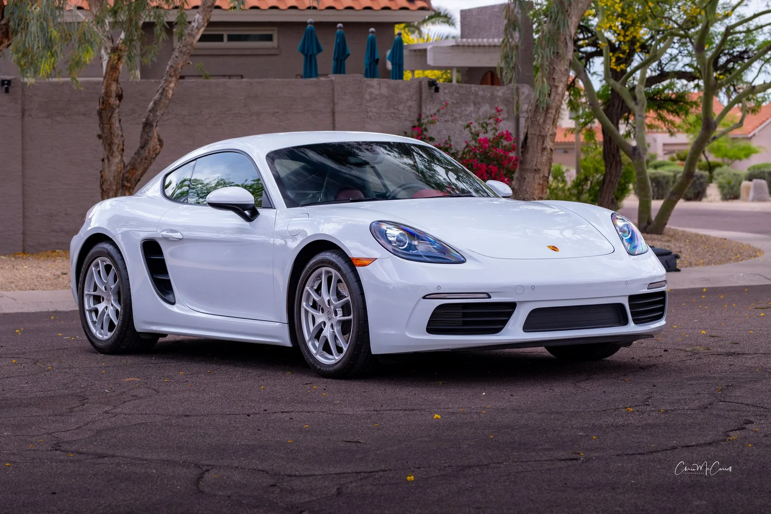 White Porsche: front three-quarter portrait; sculptural bodywork and premium contrast.
