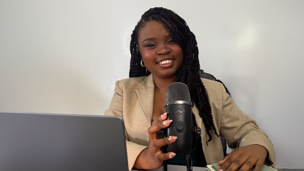 Founder of Constant Creates, Faye, speaking about branding services into a microphone.