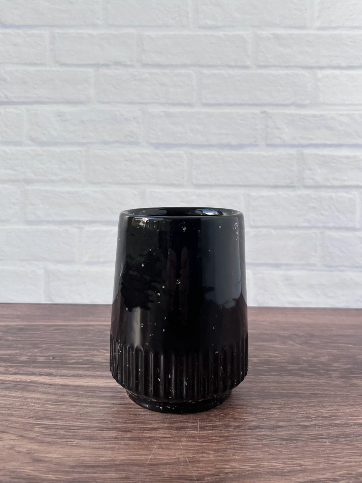 Handmade ceramic tumbler with glossy black and white speckled glaze – 10 oz stoneware cup