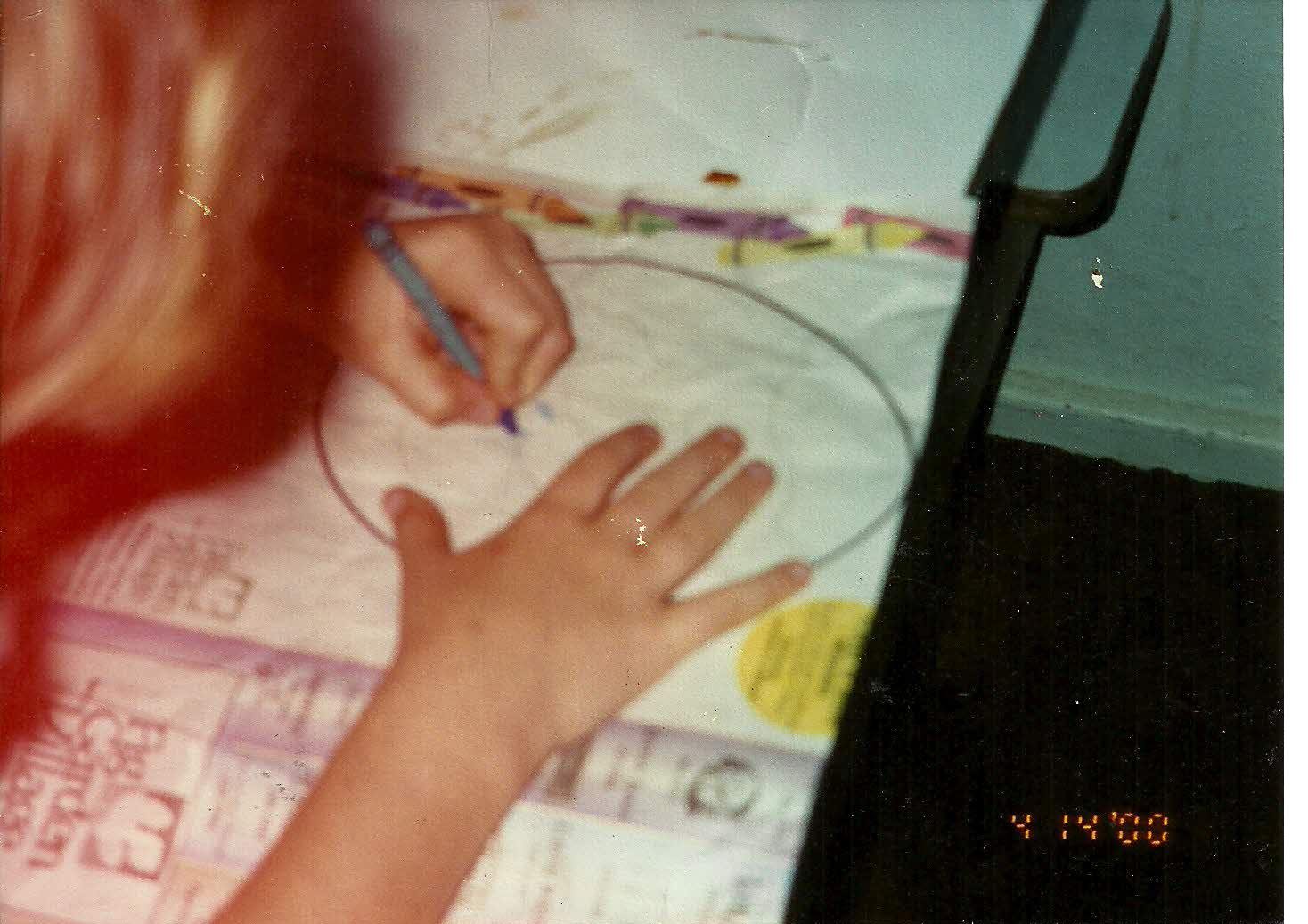 A child drawing on a piece of paper