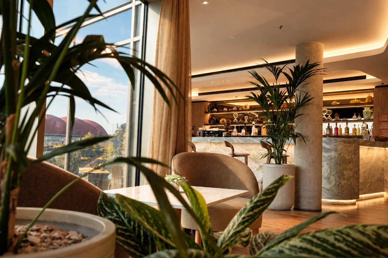 Warm Modern Lounge Bar Framed by Greenery.jpeg