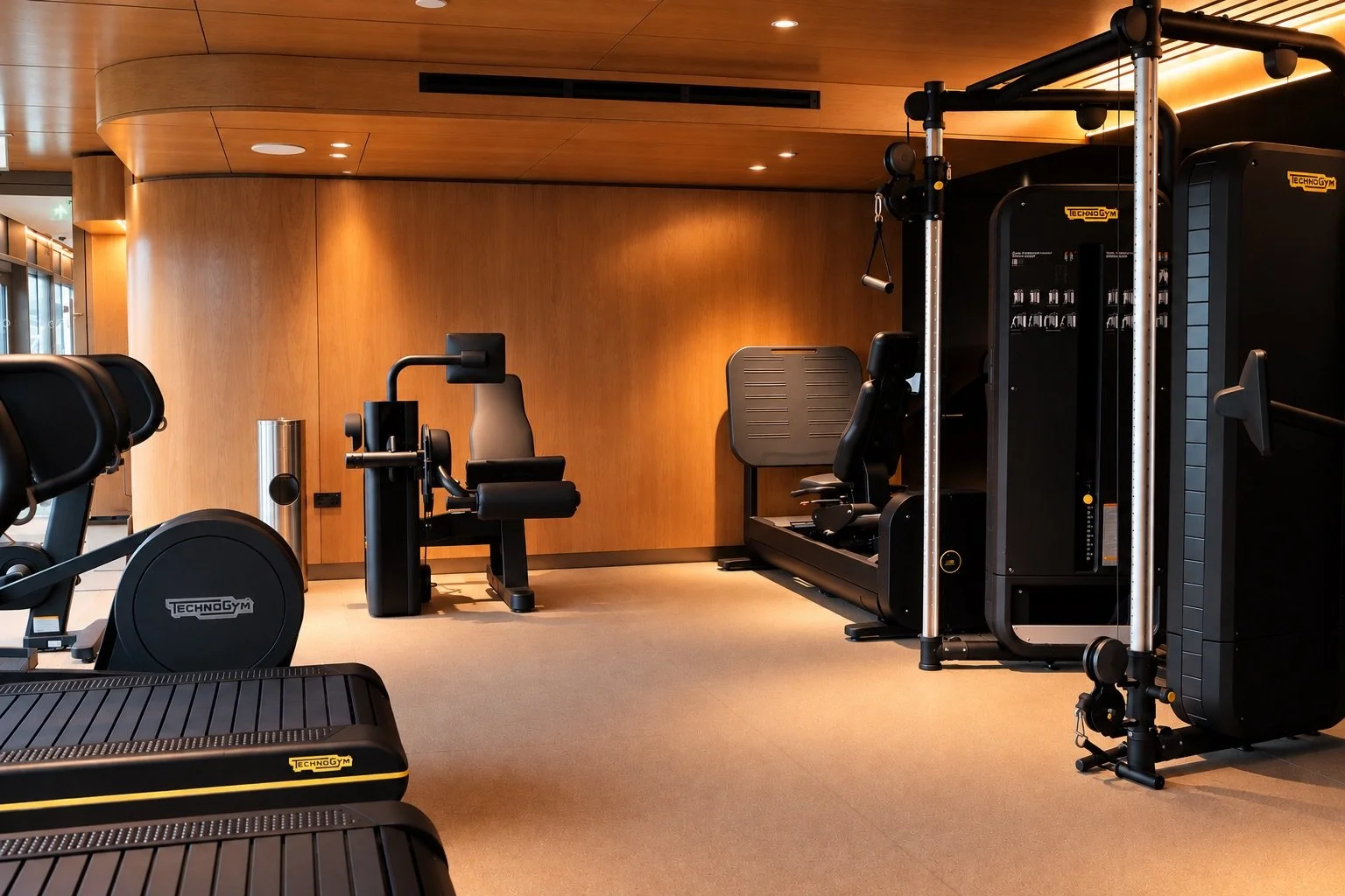 Luxury Wood-Paneled Technogym Gym.jpeg