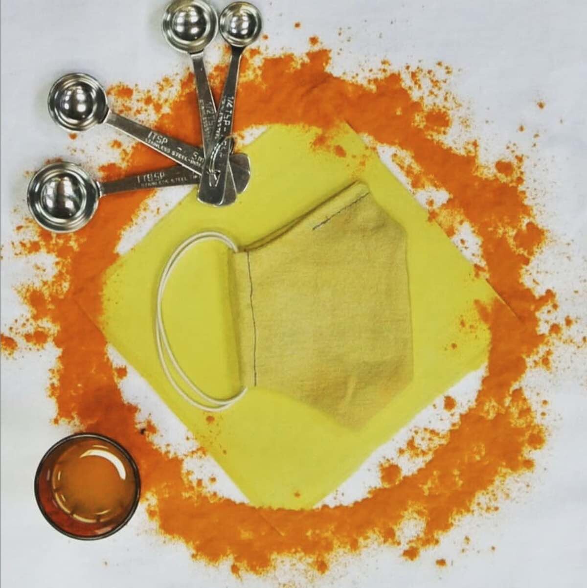 Eco-friendly facemask dyed in Turmeric.