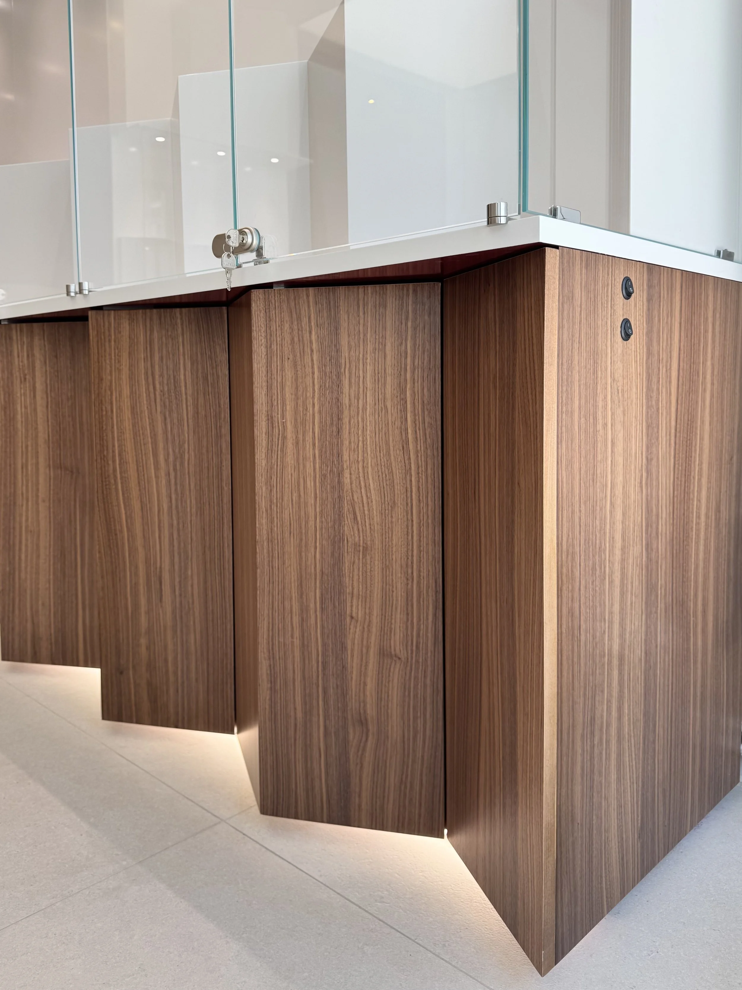 Walnut veneer furniture detail showcasing the natural wood grain