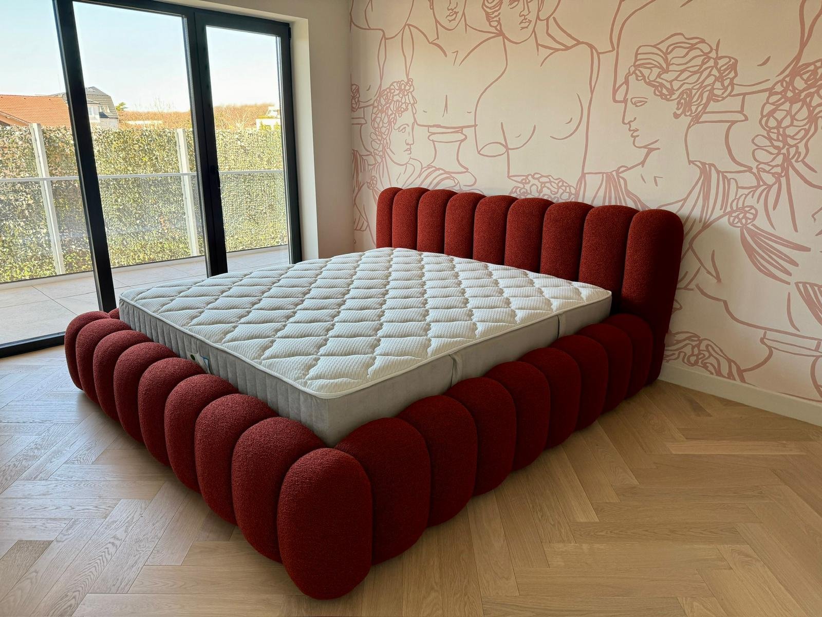 cloud bed in terracotta boucle.jpg