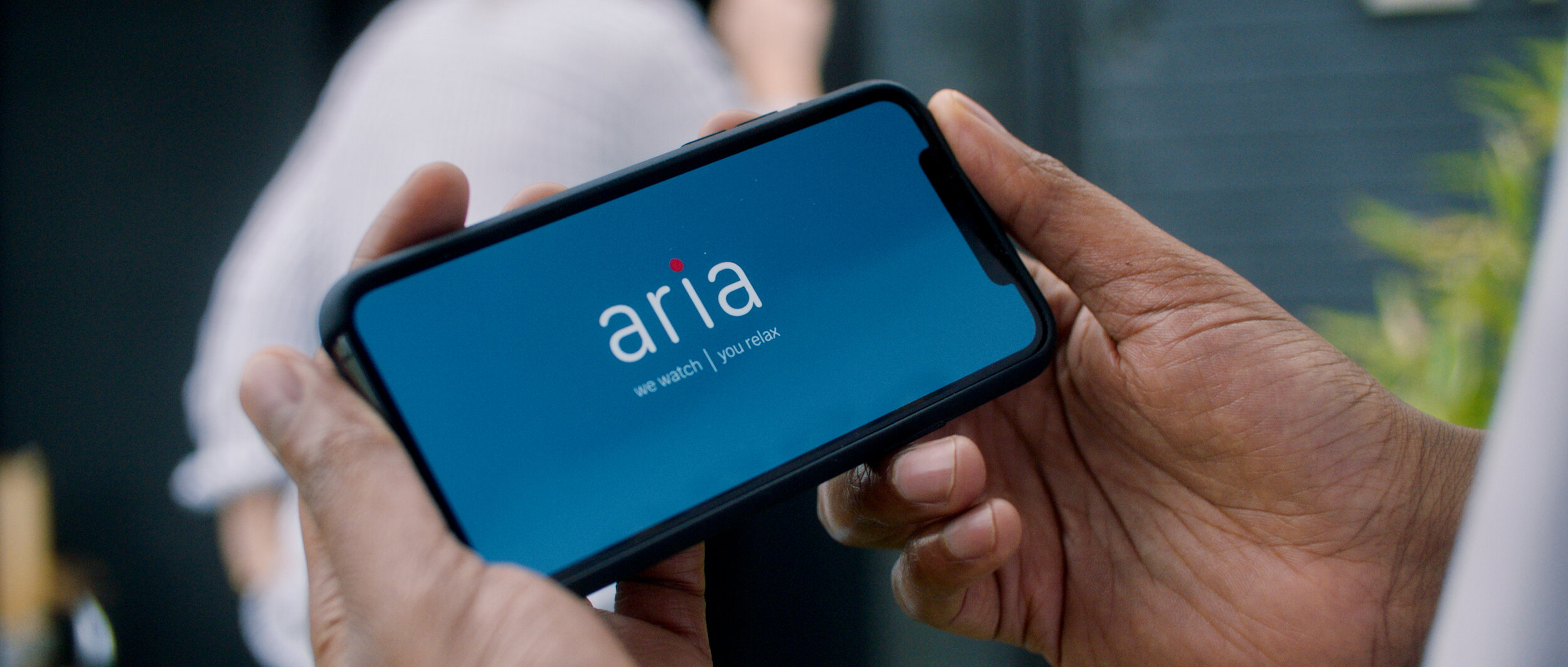 03 Aria logo on phone.jpeg