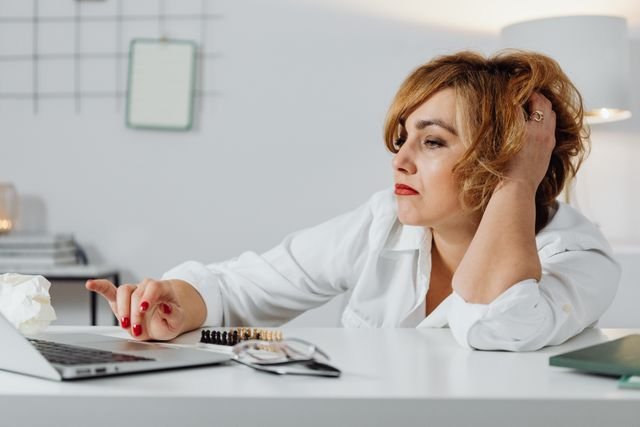 woman looking at laptop