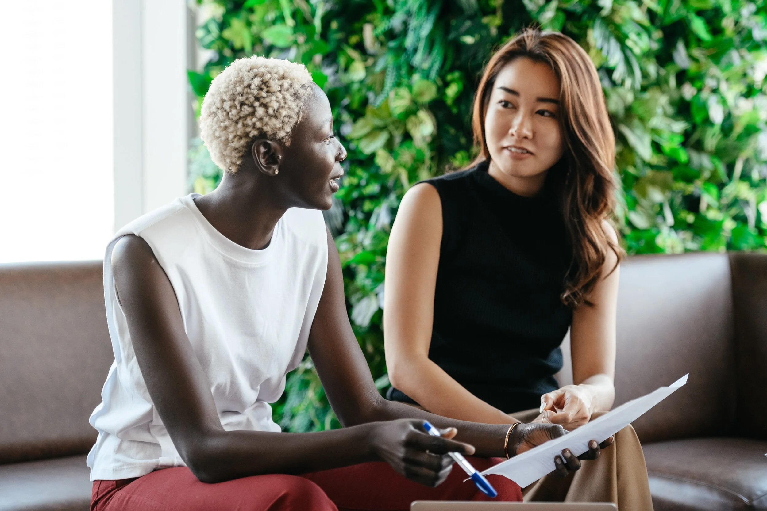 two women discussing an issue together