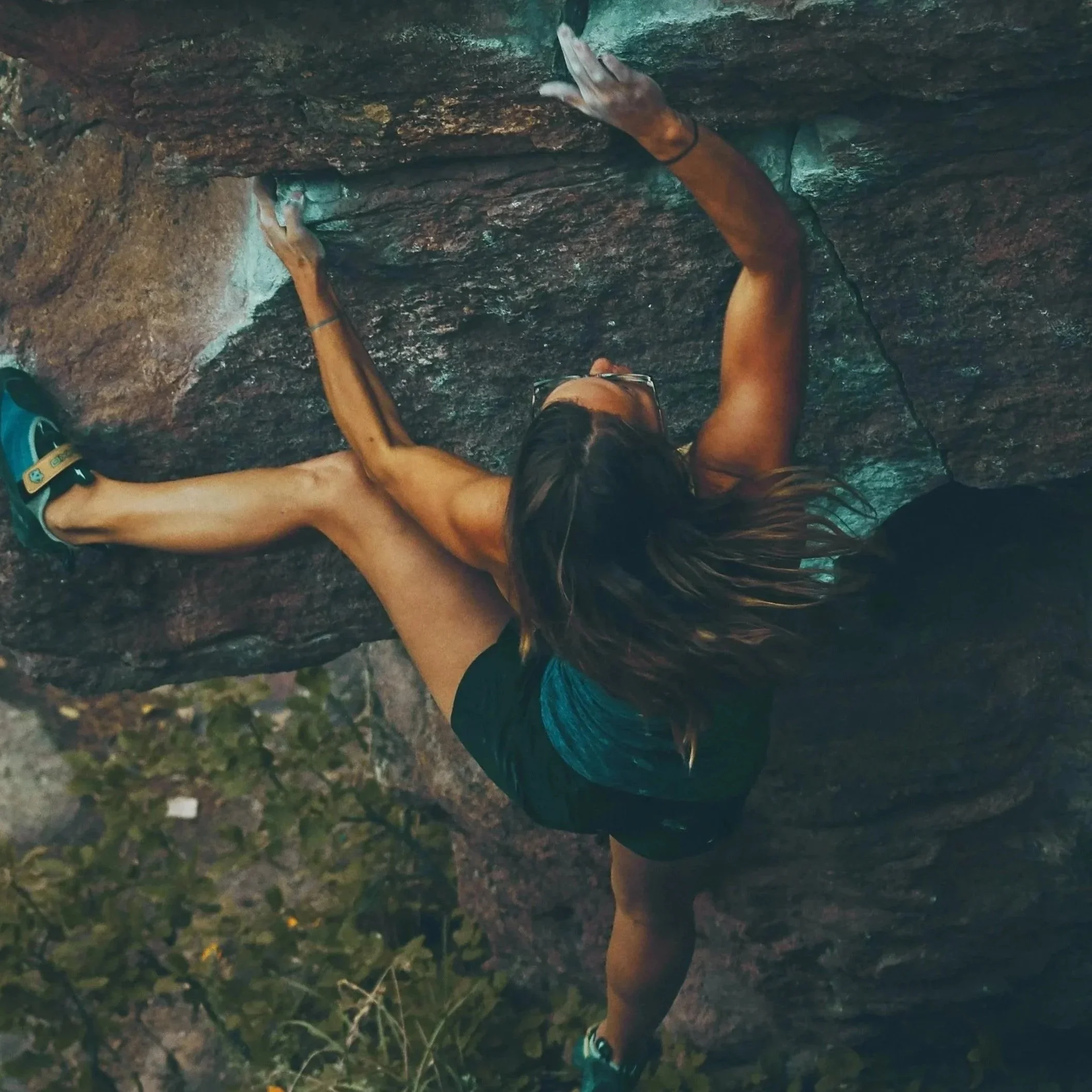 woman rock climbing