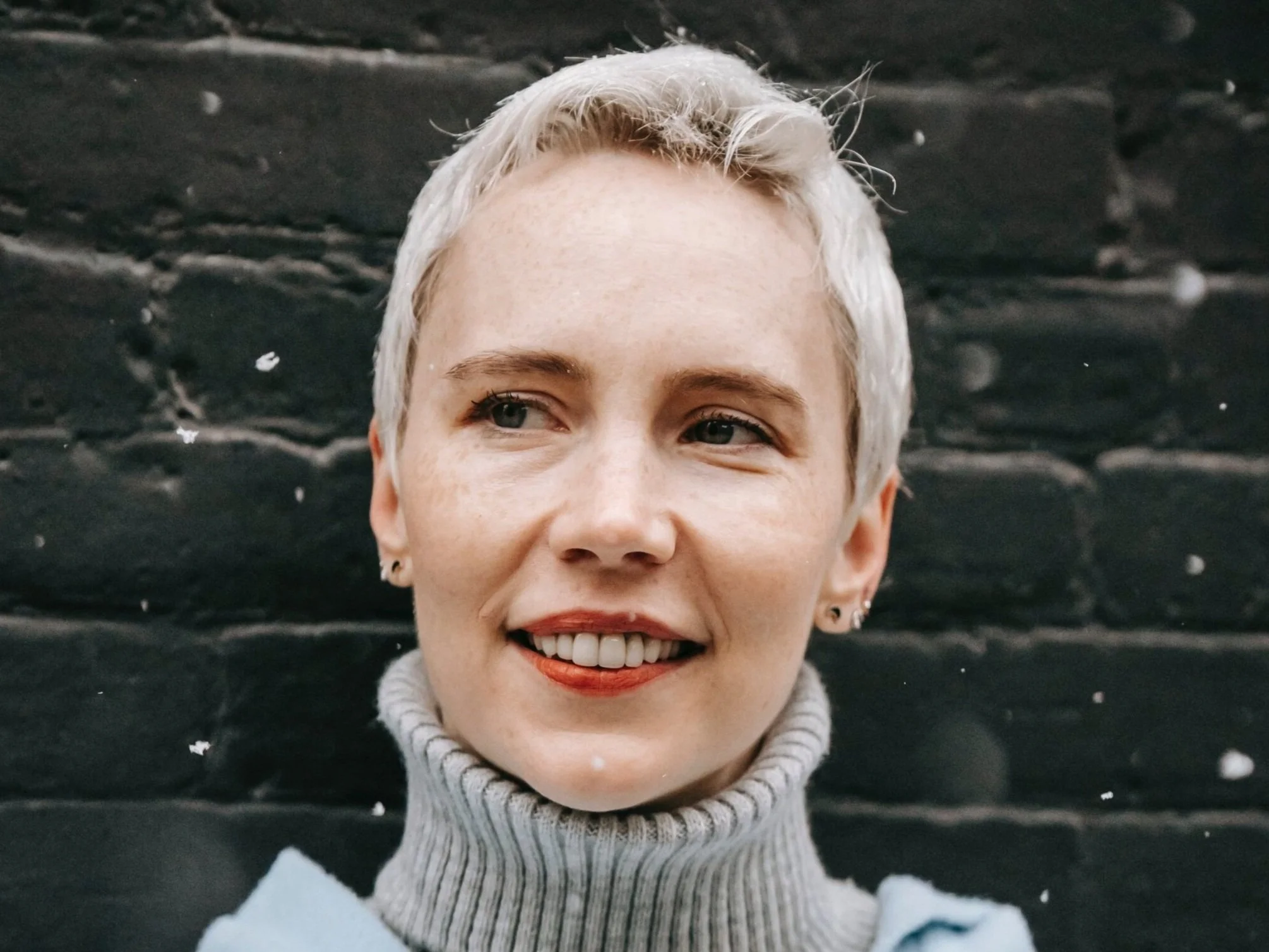 woman cropped hair smiling