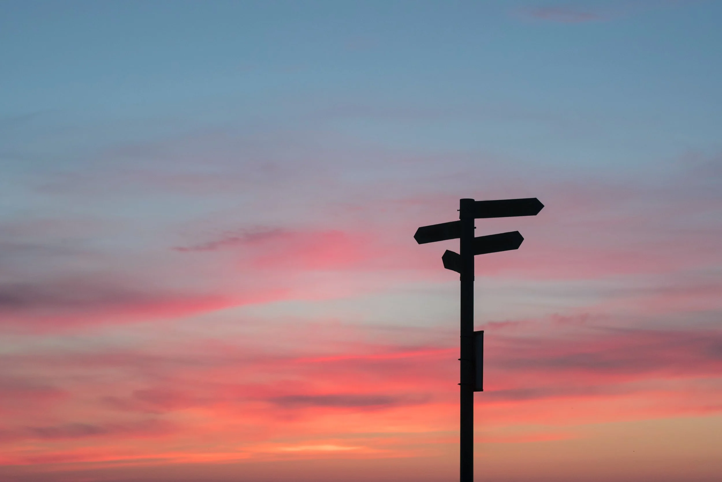 signpost sunset