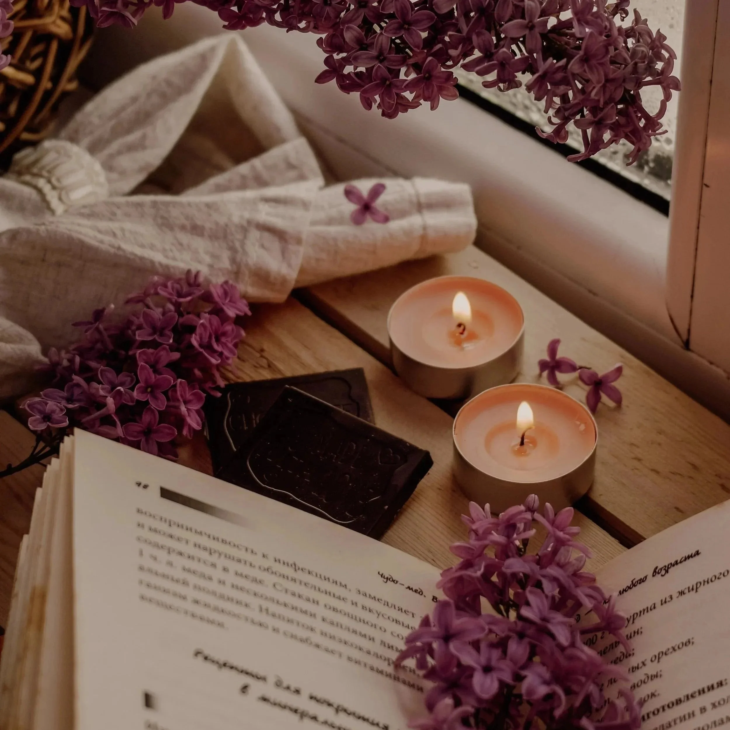 book lilacs candle