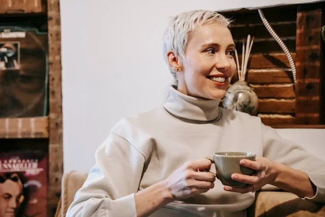 woman smiling coffee cup