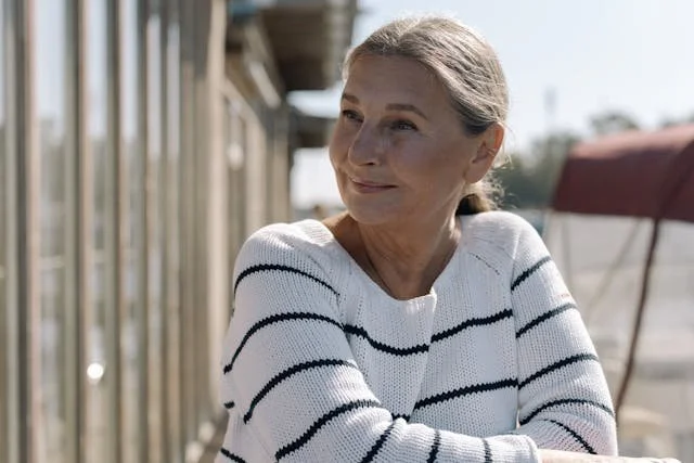 woman smiling wearing jumper