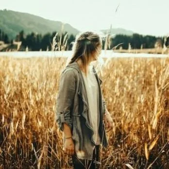 woman standing in a field