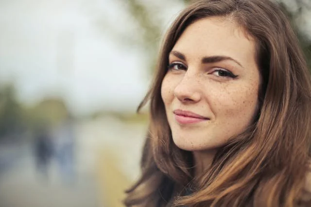 woman with brown hair smiling