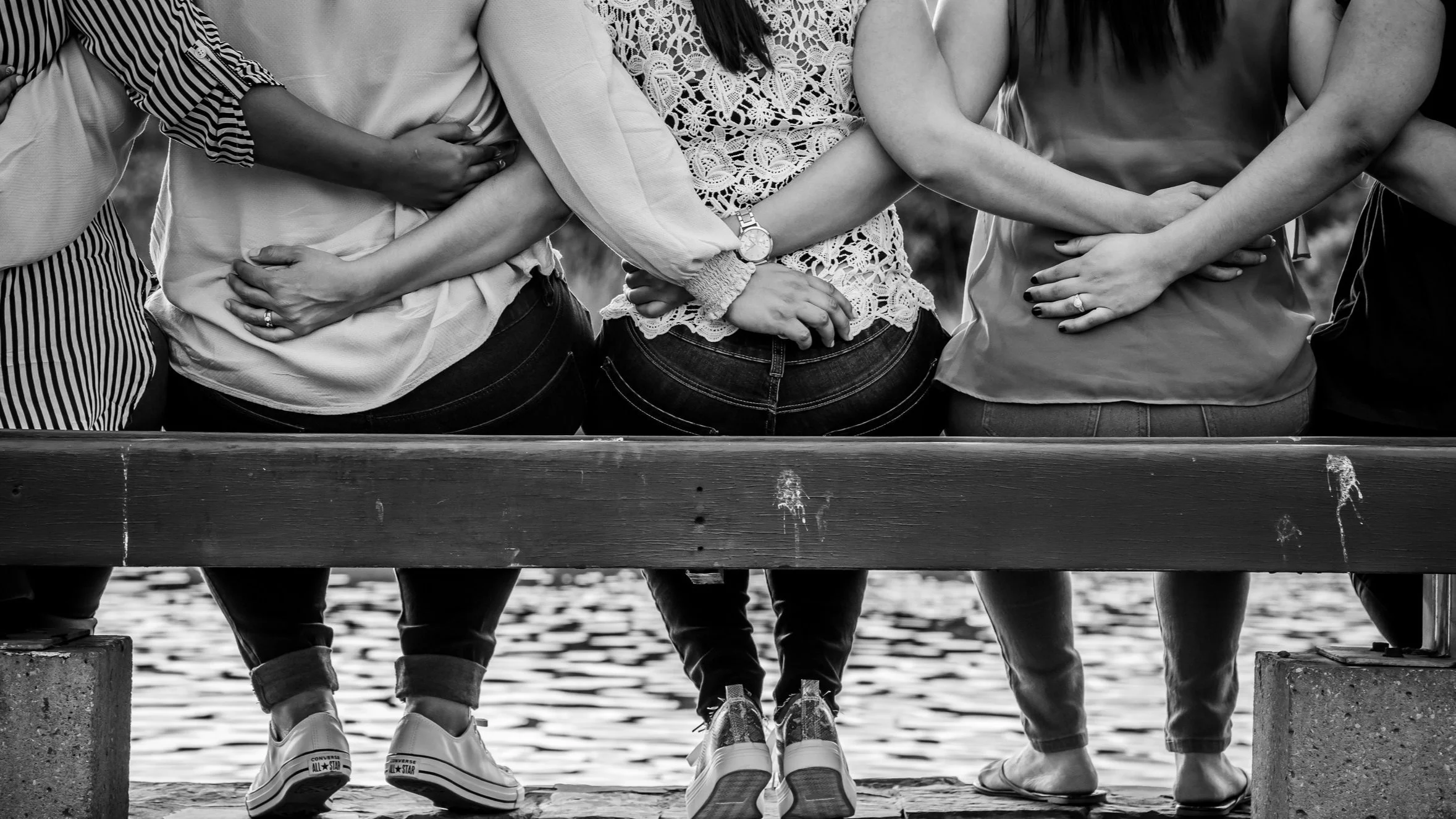 woman hugging on bench