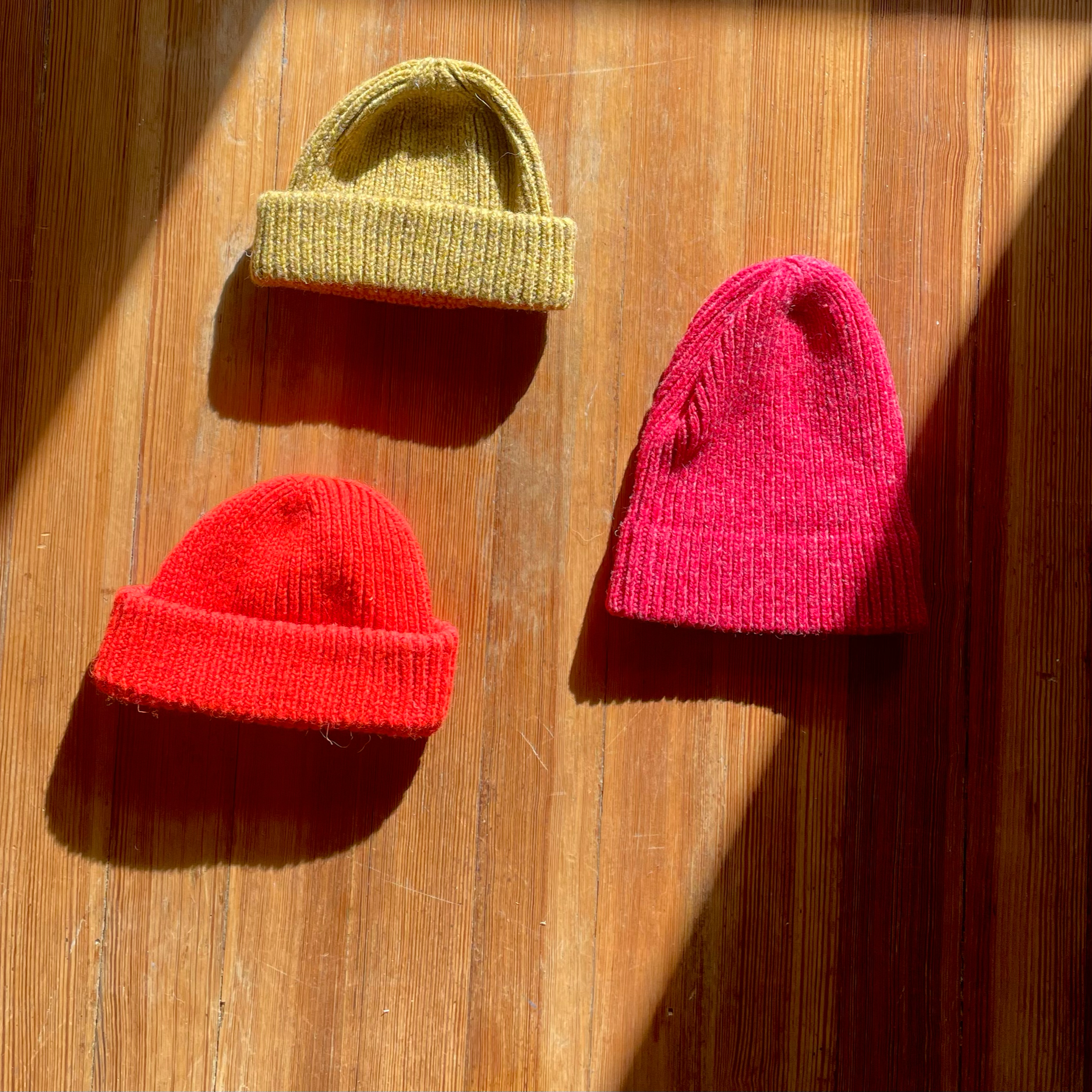 camel, bright orange, and courage classic wool beanies