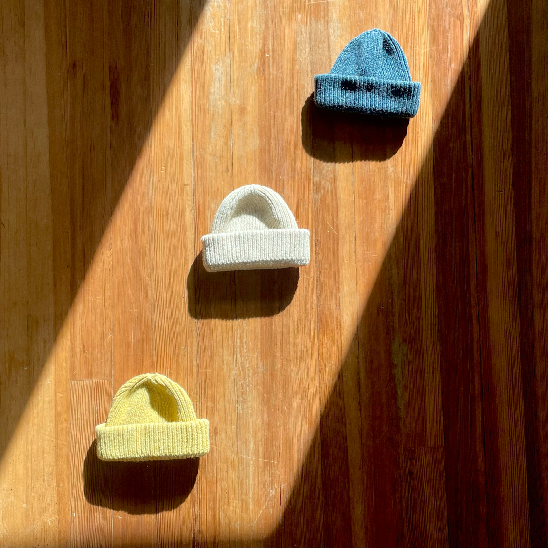 classic wool beanies, winter sun, white sand, and sea blue