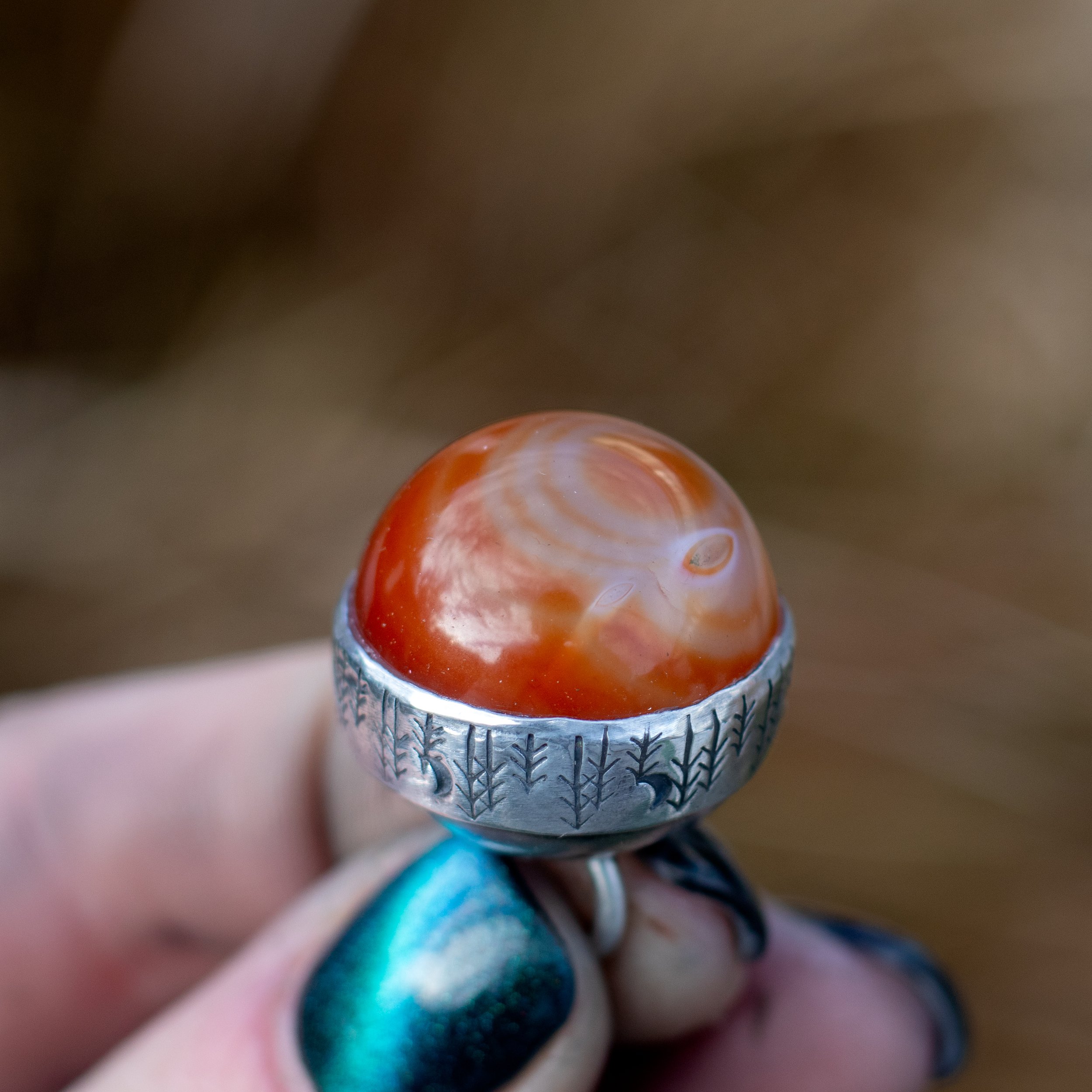 Carnelian gemstone in a silver casing.