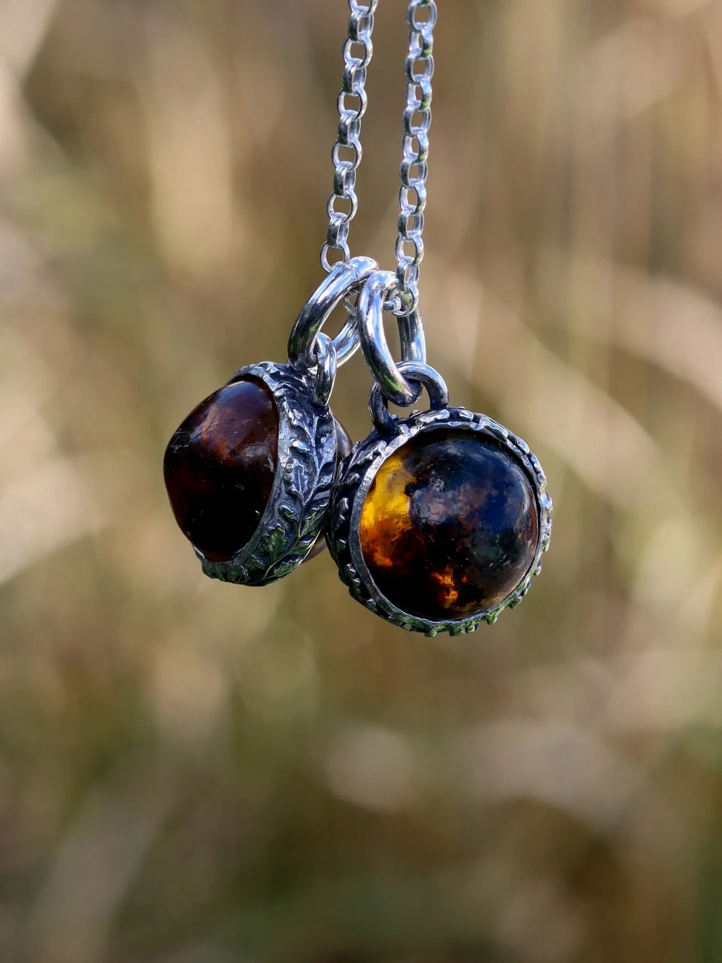 A custom design for a lovely client of mine that loves Amber and when I found these hand carved spheres I had to get them!  With a ring of  leaves around the rustic ball that glows with an ember deep within her, can you see it? 

#gemheavenjewellery 