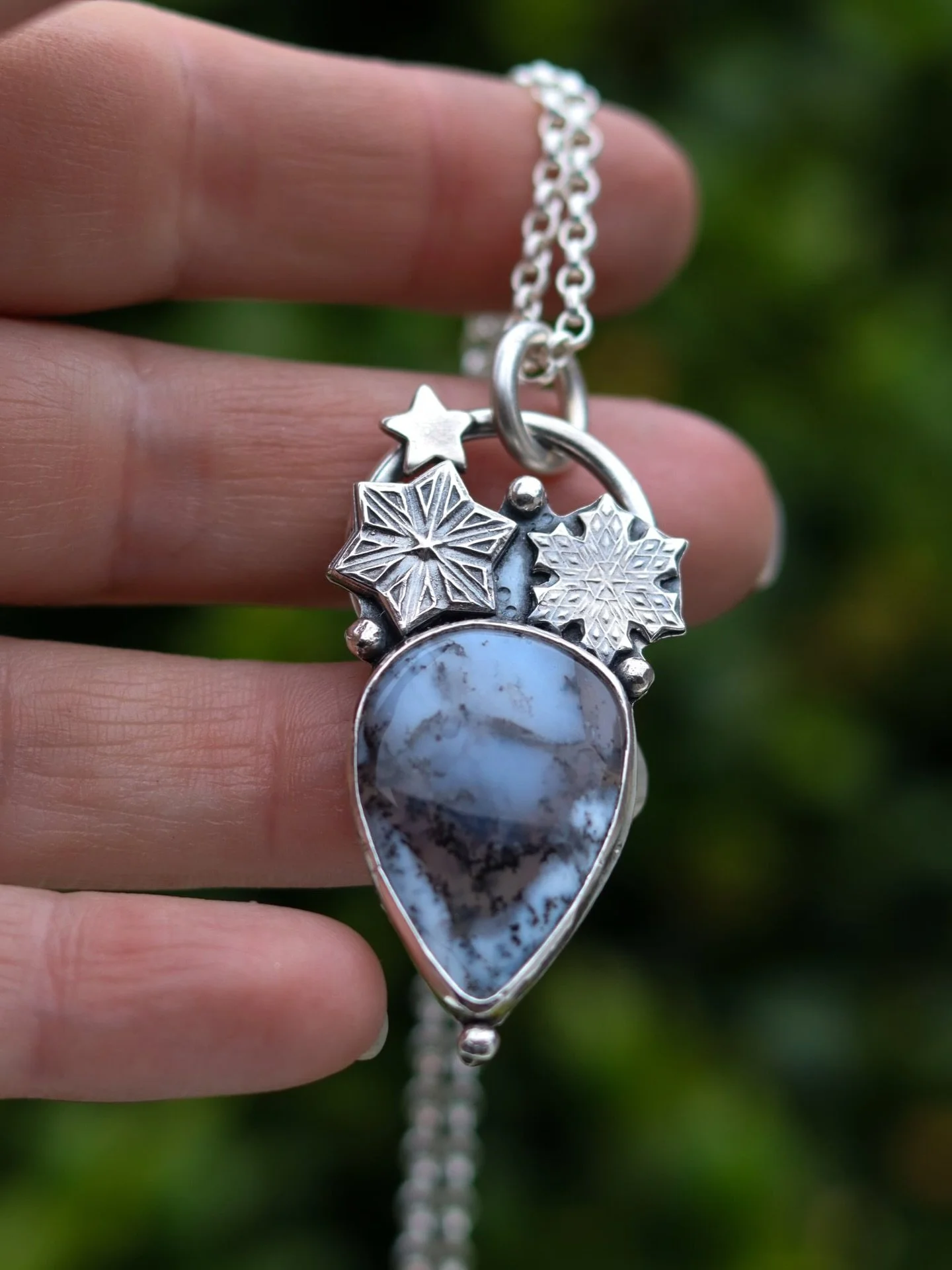 Kissed by winters starlight this one of a kind sterling silver piece with her dreamy dendritic agate with a look of frost and snowflakes under clear starlit skies.

For those of us that embrace the cold winters nights, the glistening ground covered i