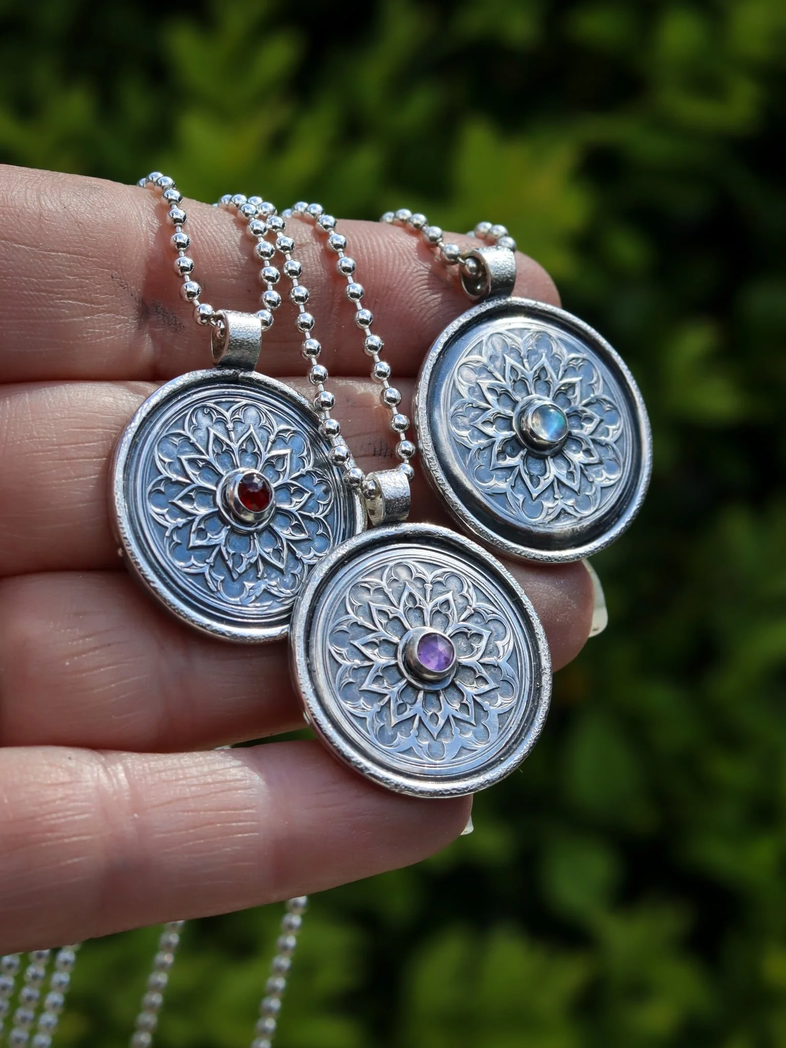 The Centre of your Universe 

A beautiful medallion created by pressing silver into an impression die (by @geminaltd ) I just love this medieval looking rose window, of course I had to make it mine by adding a little gemstone - these are added to bal