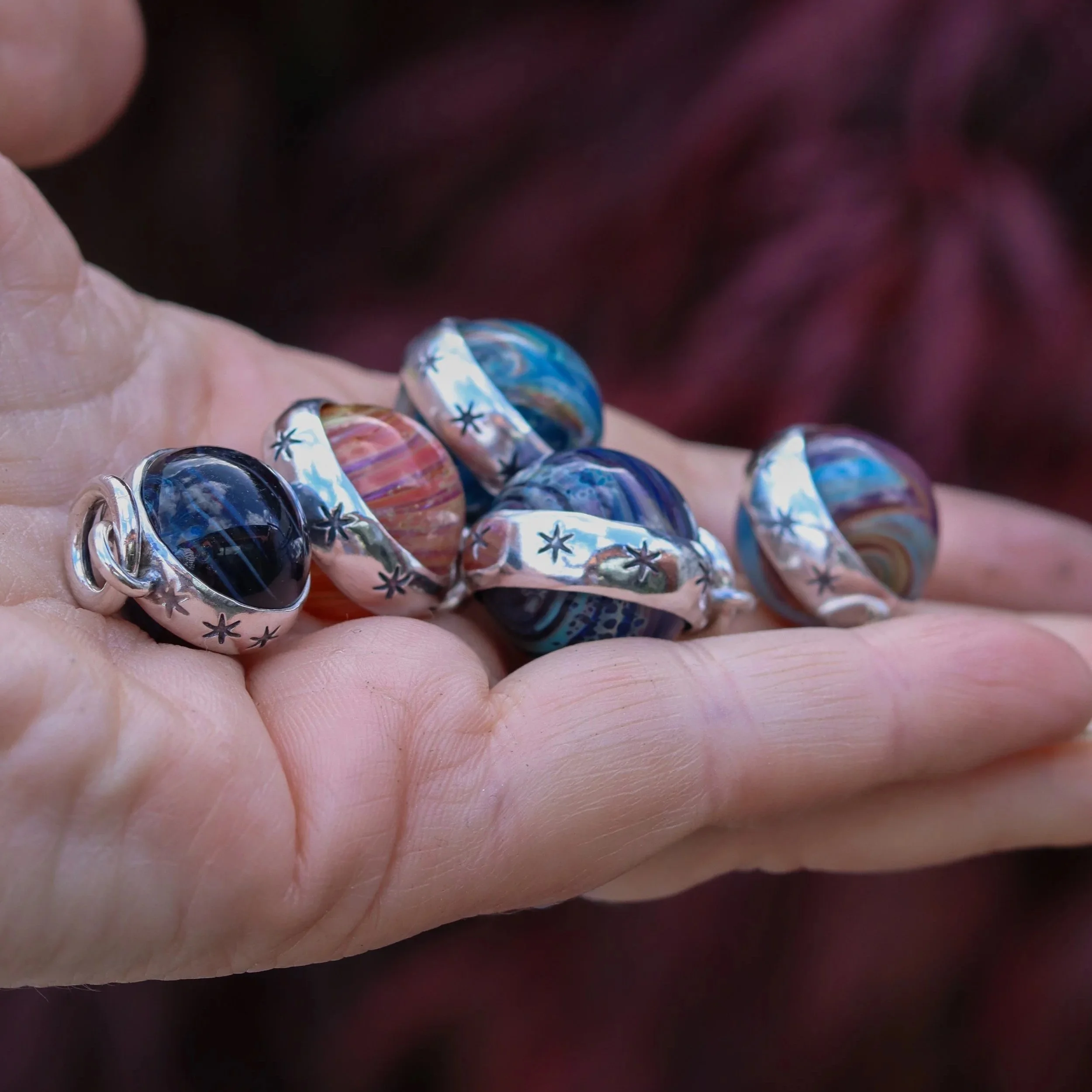 The Planetary Spinner charm