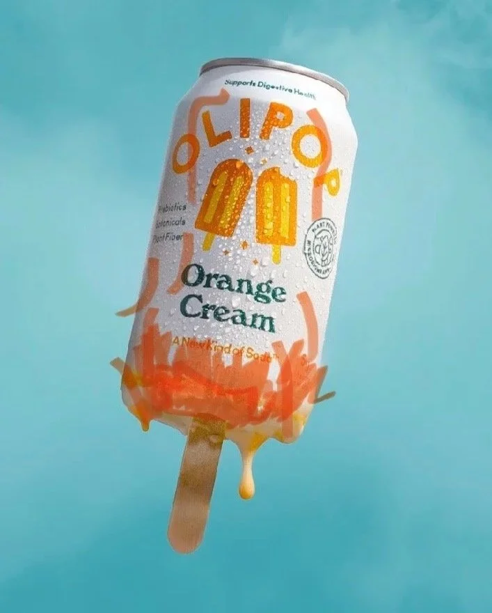 Can of orange cream soda, melting into a popsicle, there are retouching mark ups on the can to show where the details I want to enhance for my retoucher.