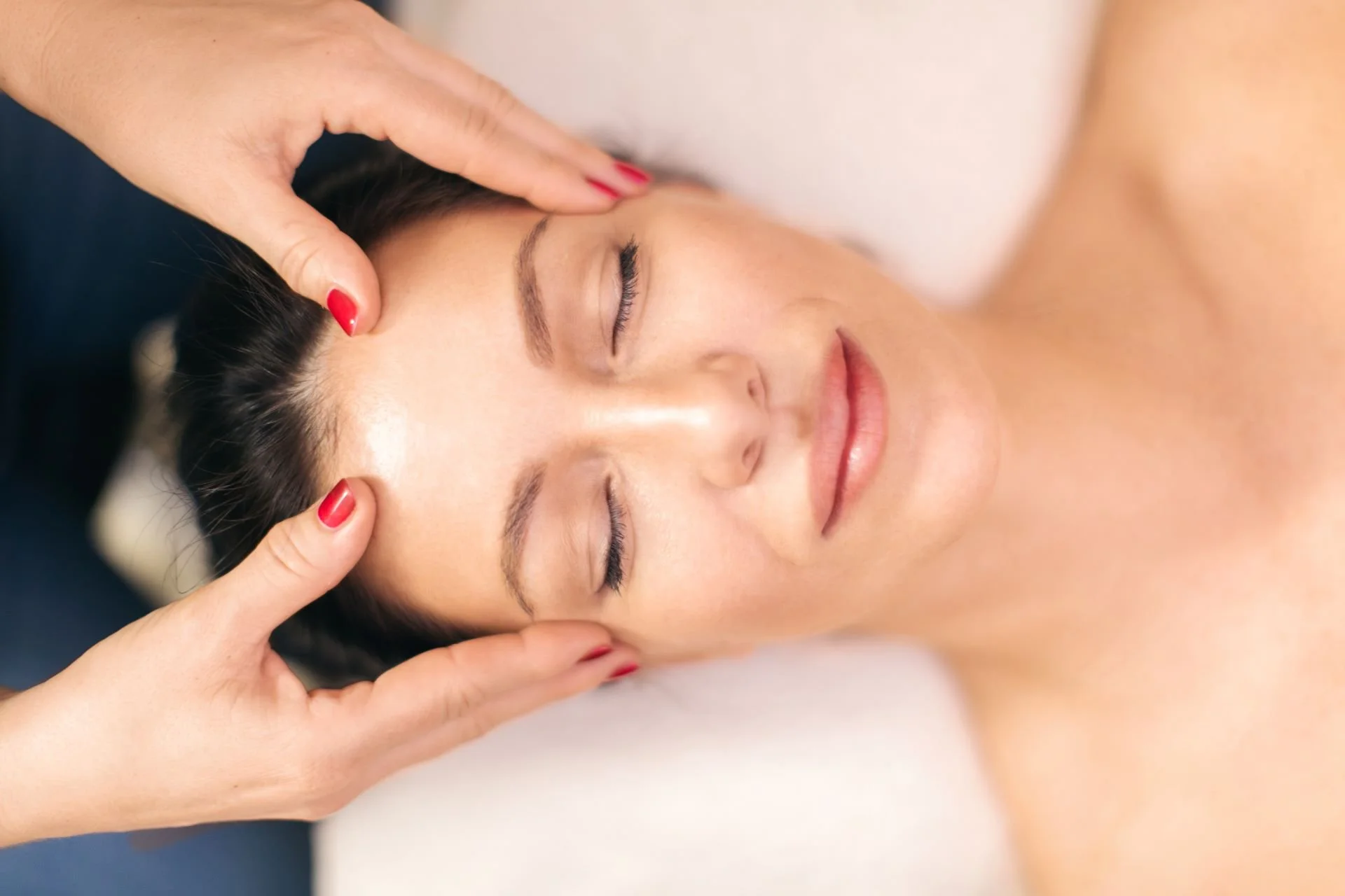 Ozempic Face Before and After Massage: Treatments & Natural Fixes - Woman+receiving+face+massage+in+spa+center