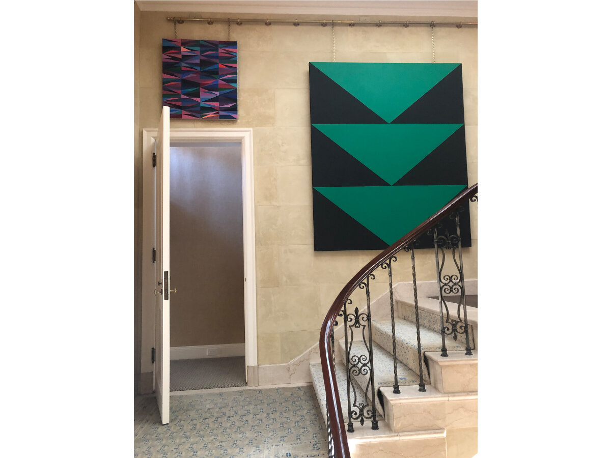  Stairwell installation via linked-chain hanging system, custom-designed by JPFA, allows for flexible art displays 